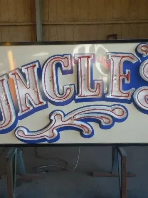 uncles cabinet with channel letter and neon
